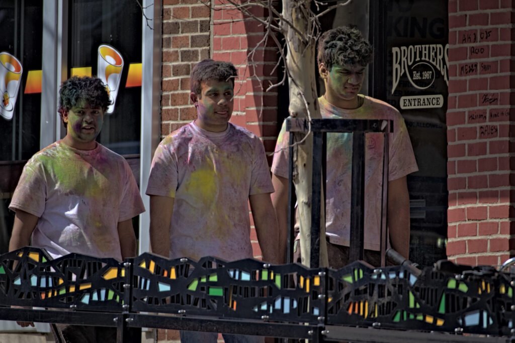 West Lafayette Downtown (Chauncey Village), 2026-03-29 - Three Men Walking in Front of Bars